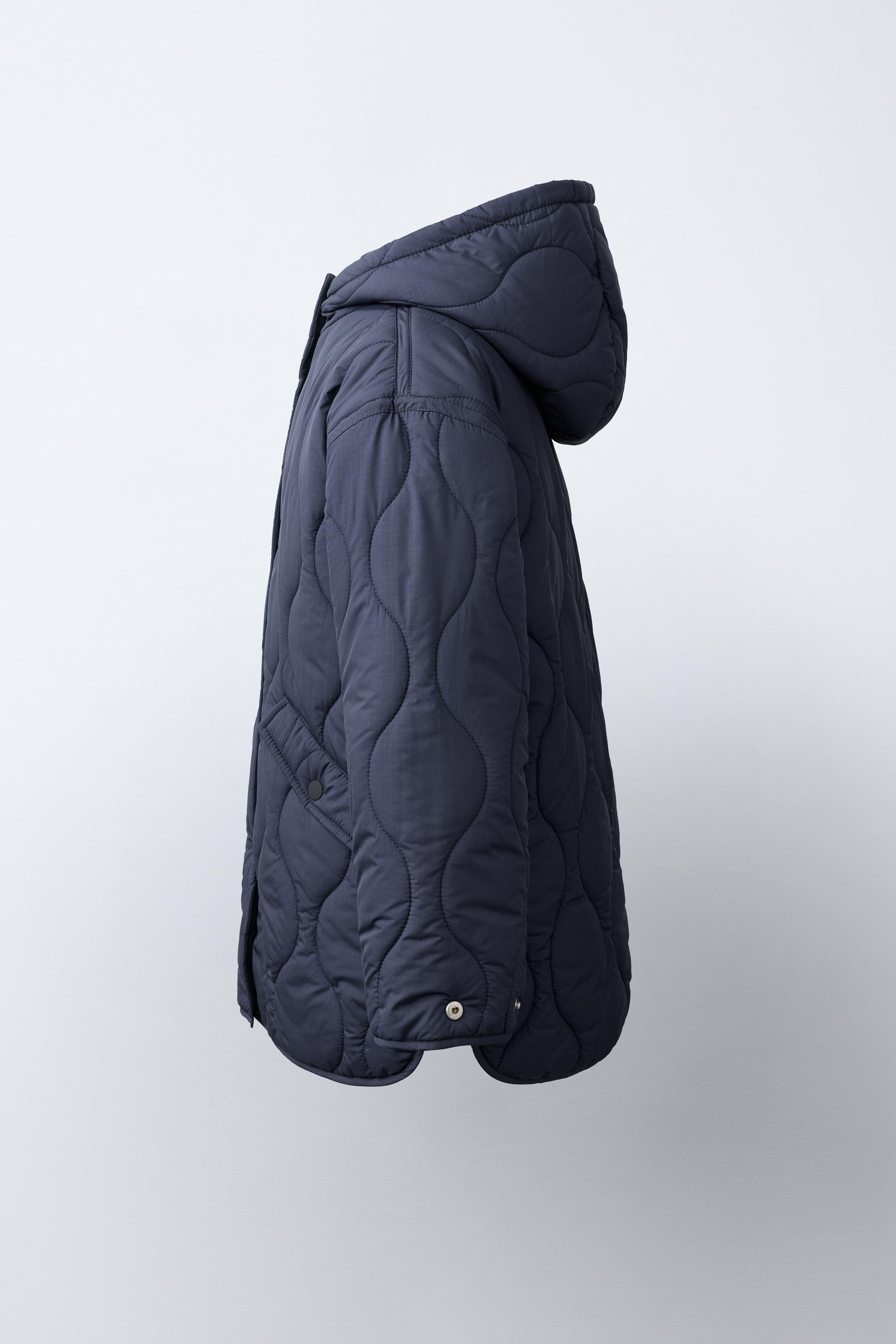BLOUSON MATELASSÉ À CAPUCHE DÉPERLANT